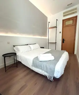 Cama o camas de una habitación en H21 Rooms