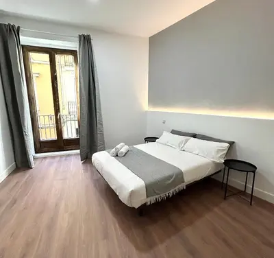 Cama o camas de una habitación en H21 Rooms
