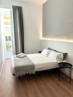 Cama o camas de una habitación en H21 Rooms
