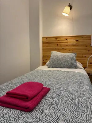 Cama o camas de una habitación en Hostal Goyal Pizarro