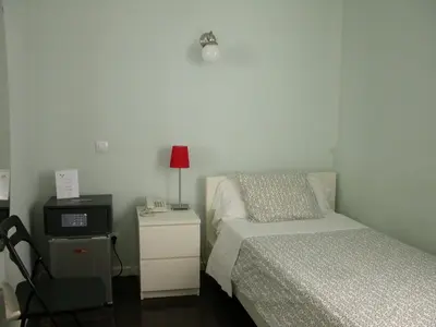 Cama o camas de una habitación en Hostal Goyal Pizarro