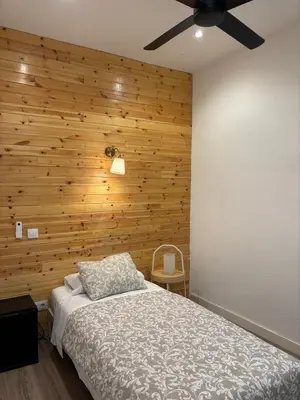 Cama o camas de una habitación en Hostal Goyal Pizarro