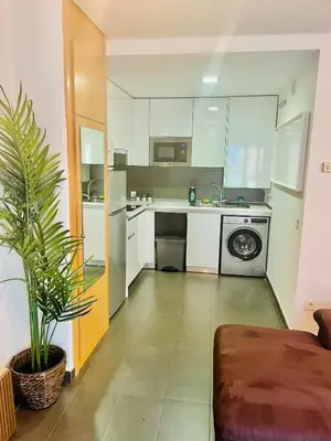 Una cocina o zona de cocina en ATICO CON TERRAZA - cerca a MADRID RIO