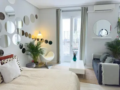 Cama o camas de una habitación en DISFRUTA del Barrio de las Letras Tu segundo hogar en Madrid