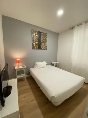 Cama o camas de una habitación en CH Six Rooms Relatores