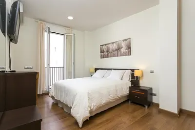 Cama o camas de una habitación en Apartments Center Madrid