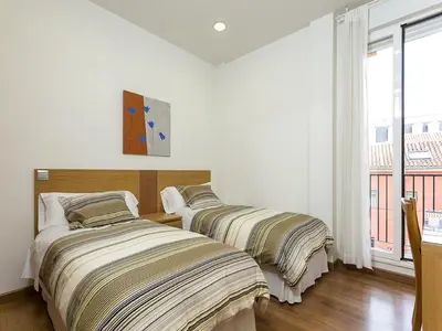 Cama o camas de una habitación en Apartments Center Madrid