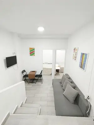 Una televisión o centro de entretenimiento en JM11SI Piso 2 dormitorios WIFI Fibra