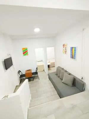 Una televisión o centro de entretenimiento en JM11SI Piso 2 dormitorios WIFI Fibra