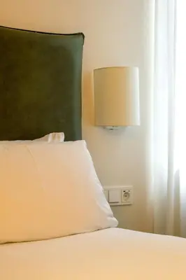 Cama o camas de una habitación en Colectia Stays Gran Vía