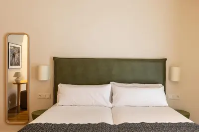 Cama o camas de una habitación en Colectia Stays Gran Vía