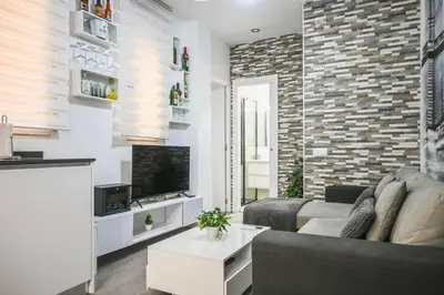 Una televisión o centro de entretenimiento en For You Rentals Moderno y Cómodo Apartamento en el Centro Temporal EMB500