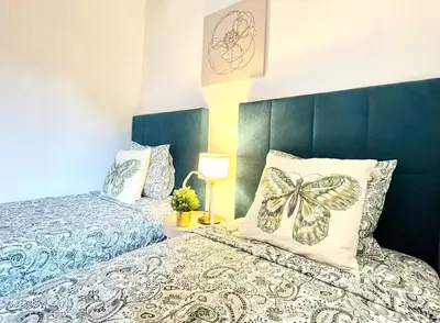 Cama o camas de una habitación en Centric Rooms Madera Gran Via