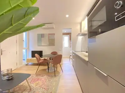 Una cocina o zona de cocina en Suites La Latiina - Madrid Centro