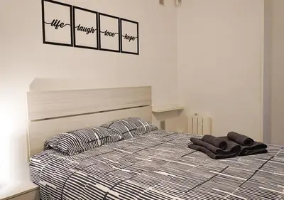 Cama o camas de una habitación en Apartamento 'Ronda de Toledo'