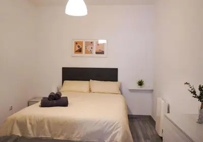 Cama o camas de una habitación en Apartamento 'Ronda de Toledo'