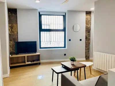 Una televisión o centro de entretenimiento en D1 Moderno apartamento en el centro de Madrid