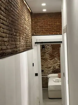 Cama o camas de una habitación en Acogedor loft en Malasaña