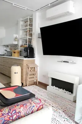Una televisión o centro de entretenimiento en Precioso junto a Sol