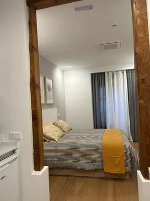 Cama o camas de una habitación en Apartamentos Gravina