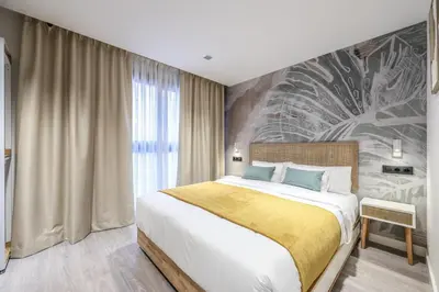 Cama o camas de una habitación en ATyCO Madrid