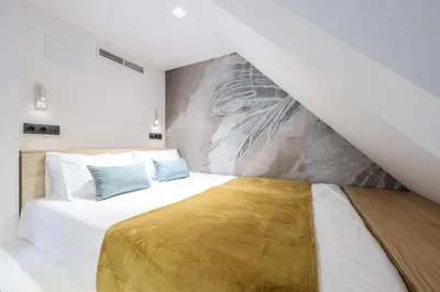 Cama o camas de una habitación en ATyCO Madrid