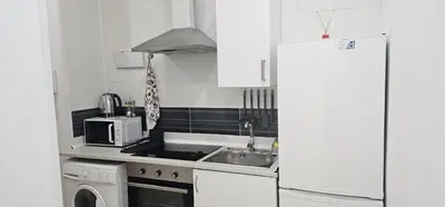 Una cocina o zona de cocina en Habitaciones Chueca