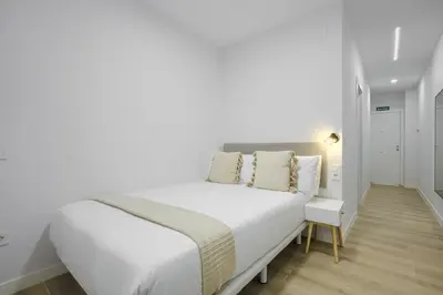 Cama o camas de una habitación en Dobo Madrid Numancia