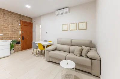 Zona de estar de Cuatro Caminos Apartment
