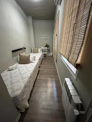 Cama o camas de una habitación en El Hostall