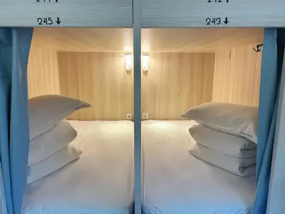 Cama o camas de una habitación en UNPLAN Hostel