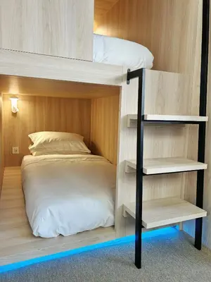 Cama o camas de una habitación en UNPLAN Hostel