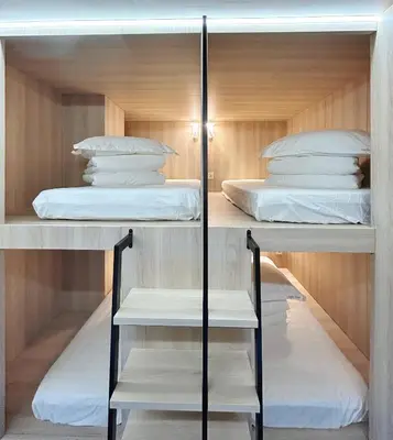 Cama o camas de una habitación en UNPLAN Hostel