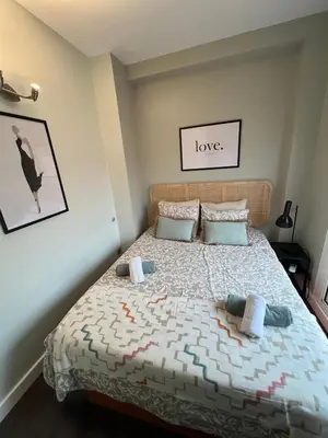 Cama o camas de una habitación en Duplex con terraza privada en Atocha Delicias Madrid Rio