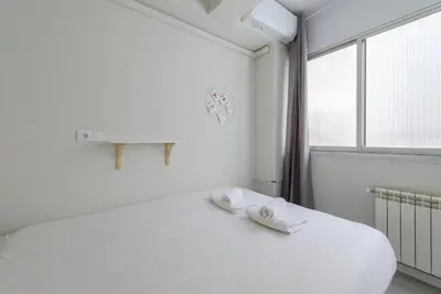 Cama o camas de una habitación en GuestReady - Embajadores Apartments