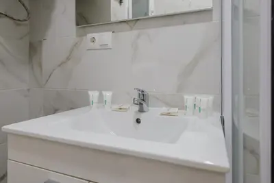 Un baño de GuestReady - Embajadores Apartments