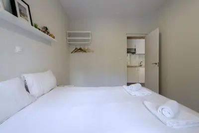 Cama o camas de una habitación en GuestReady - Embajadores Apartments