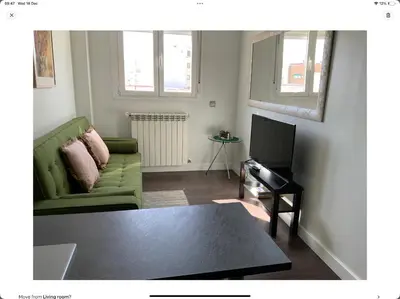 Una televisión o centro de entretenimiento en Apartamento 5B Atocha Delicias Madrid Rio
