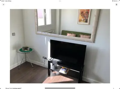 Una televisión o centro de entretenimiento en Apartamento 5B Atocha Delicias Madrid Rio
