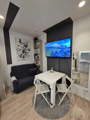 Una televisión o centro de entretenimiento en Apartamento céntrico y Acogedor