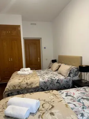 Cama o camas de una habitación en El sol de Madrid n1