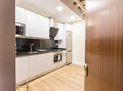Una cocina o zona de cocina en Cómodo y precioso apartamento