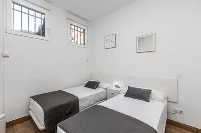 Cama o camas de una habitación en Apartamento a 5 minutos del centro de Madrid 6P