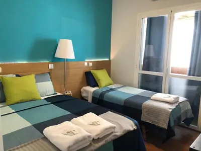 Cama o camas de una habitación en Apartamentos EconoStay Callao