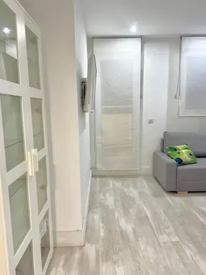 Zona de estar de Piso Ático con Terraza y Jacuzzi con vistas a Sol en Madrid Centro