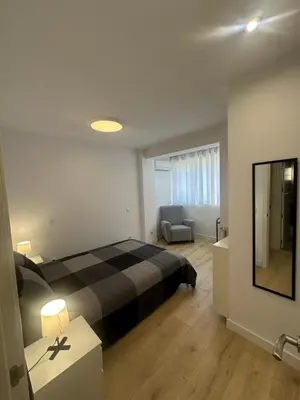 Cama o camas de una habitación en Homely Madrid River