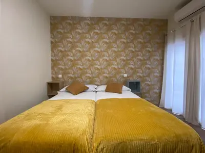 Cama o camas de una habitación en El Jardín de Fornillos