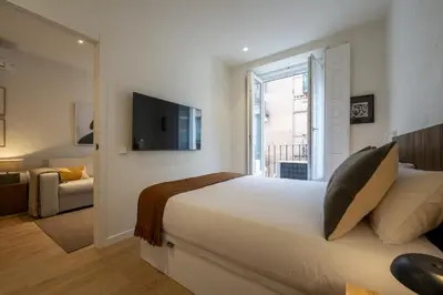 Cama o camas de una habitación en Reina Sofia Suite III