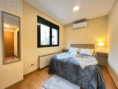 Cama o camas de una habitación en Madrid javalambre 3 Temporal