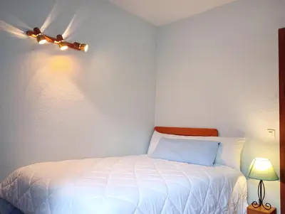 Cama o camas de una habitación en Stylish 2-Bedroom Apartment with Terrace in Central Madrid, WiFi & Metro Nearby